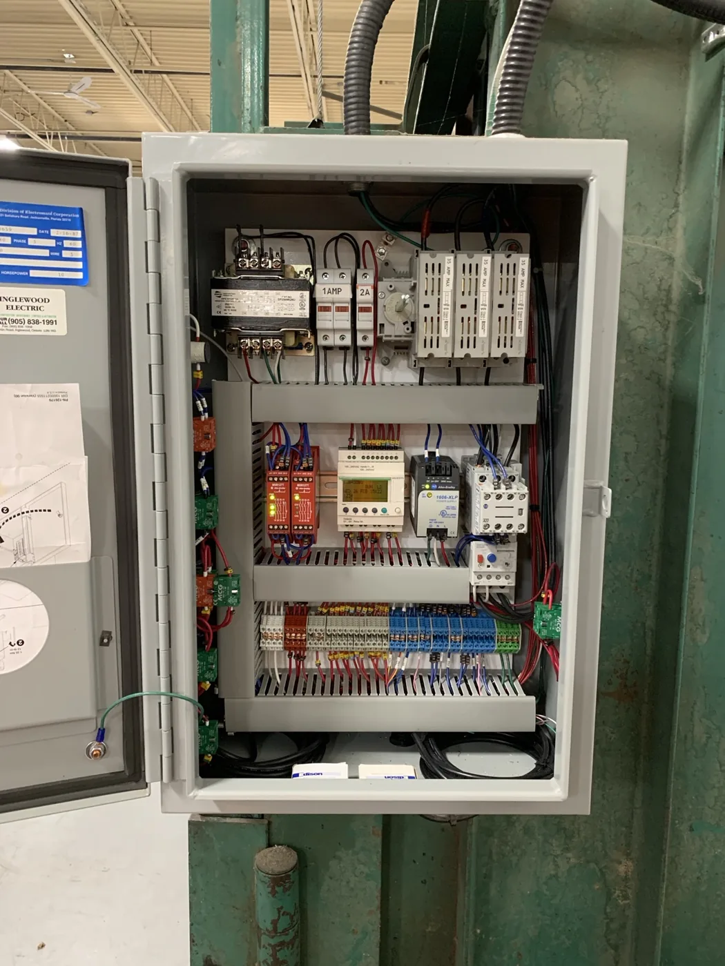 Industrial control panel with PLC, relays and motor controls
